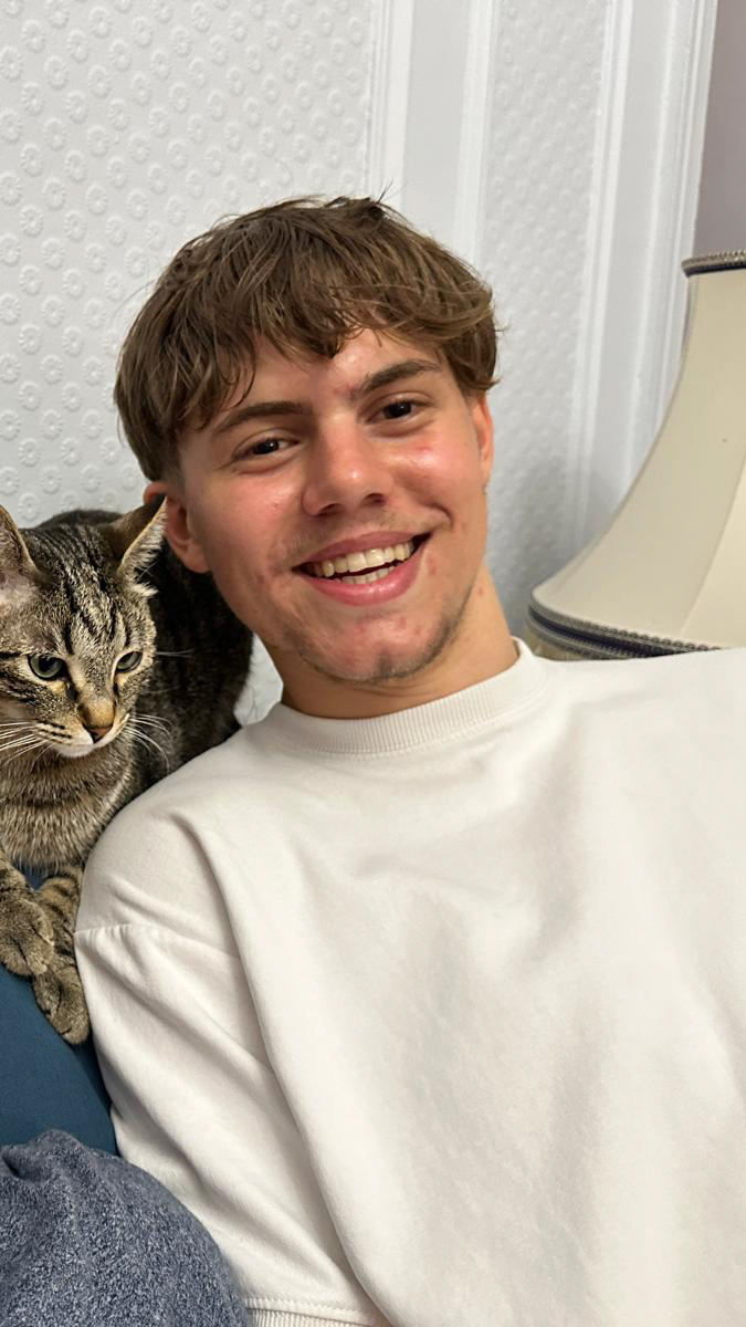 Josh at home with the workshop cat
